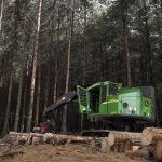 A John Deere forestry machine equipped with a Waratah H219X harvesting head, expertly navigating a South African plantation.