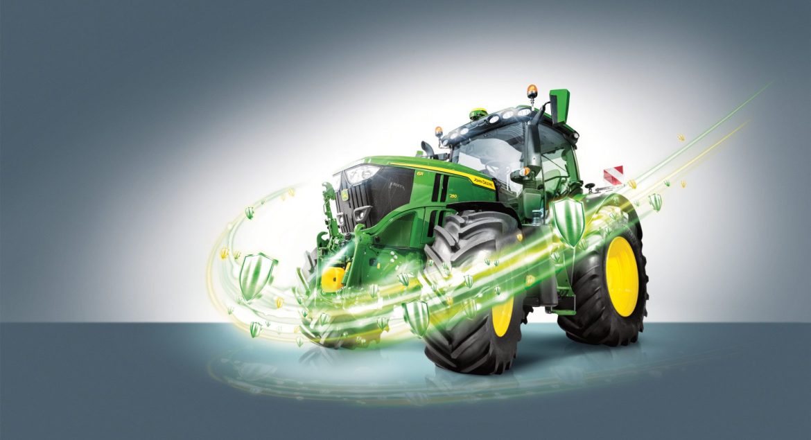 A John Deere tractor with a design and some shield moving around it signalling that the tractor is protected