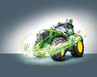 A John Deere tractor with a design and some shield moving around it signalling that the tractor is protected