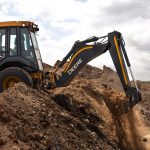John Deere 310 P-Tier TLB working on site digging