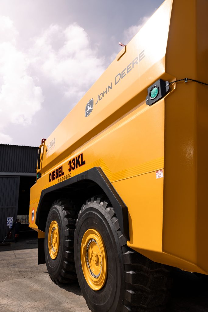 Side front view of a custom John Deere 410 P-Tier ADT