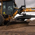 John Deere 620 P-Tier Motor Grader working on infrastructure project