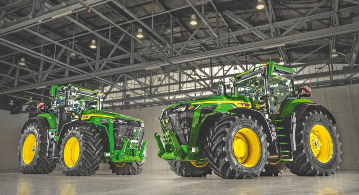 Two John Deere 8R 540 tractors as they stand in a warehouse
