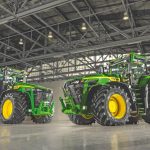 Two John Deere 8R 540 tractors as they stand in a warehouse