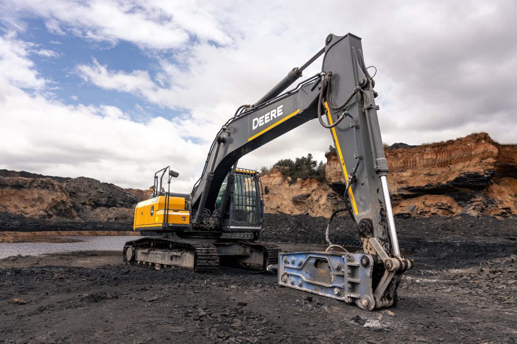 Fleet of John Deere machines, including the E210 Excavator at a South African mine.