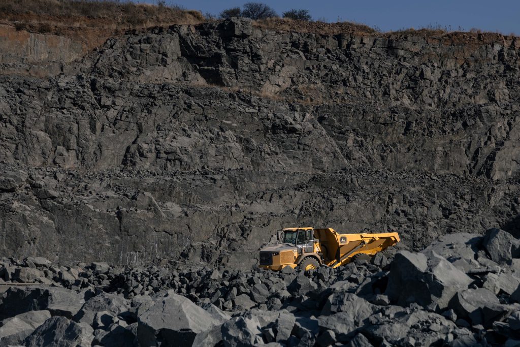 A John Deere 410 P-Tier ADT at a mining site
