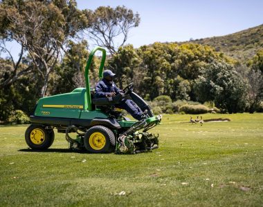 John Deere golf course mower operating on a professionally maintained golf course using TechControl™ technology.