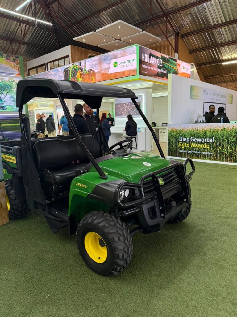 John Deere HPX815E Gator utility vehicle on display