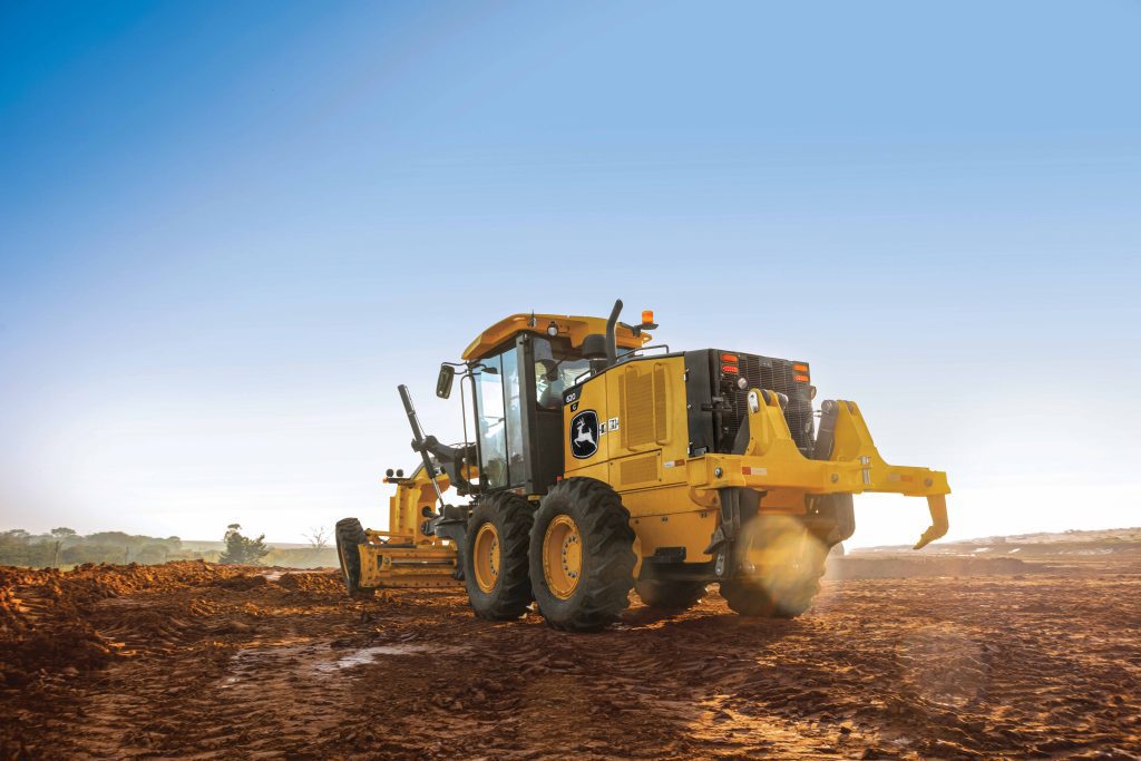 John Deere G-Tier motor grader featuring mechanical controls for reliable grading performance.