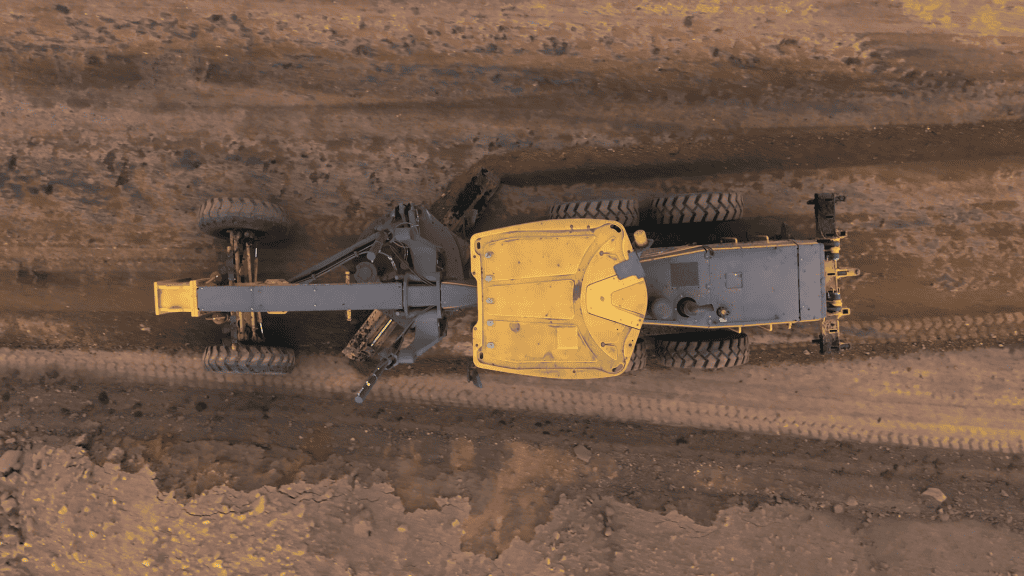 Top view of a John Deere 620 P-Tier Grader in action