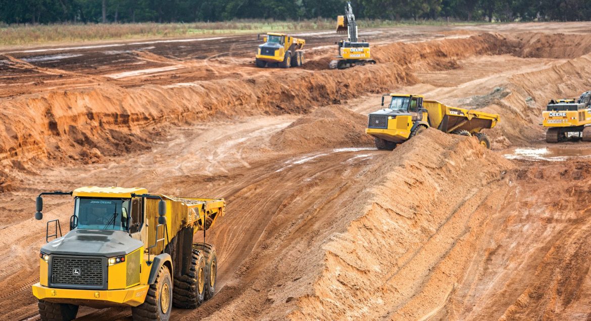 John Deere construction equipment operating across a variety of industries, including roadbuilding and site development.