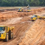 John Deere construction equipment operating across a variety of industries, including roadbuilding and site development.