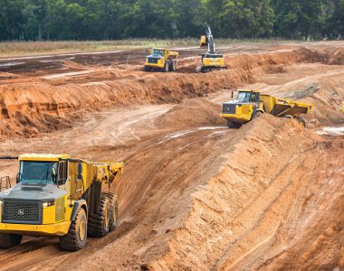John Deere construction equipment operating across a variety of industries, including roadbuilding and site development.