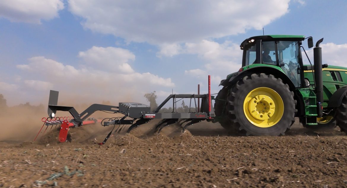 Rovic Peregrine 5.2m operating through crop residue with high frame clearance.