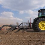 Rovic Peregrine 5.2m operating through crop residue with high frame clearance.