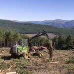 John Deere 1510G 8-wheel drive forwarder collecting timber in a plantation
