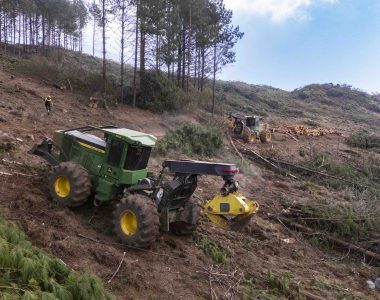 John Deere forestry machinery operating in challenging terrain
